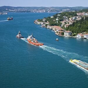 Boats towing a module of a natural gas platform through the Bosphorus, aerial, Istanbul