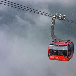 British Columbia, Whistler. Peak to Peak Gondola coming out of the clouds
