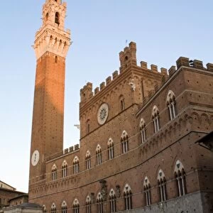 Italy, Tuscany, Sienna. Torre del Mangia at sunset