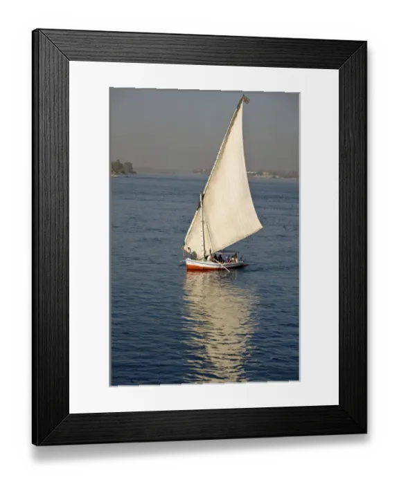 Framed Print : EGYPT, Luxor. A felluca sailboat on the waters of the Nile Framed Print : EGYPT, Luxor. A felluca sailboat on the waters of the Nile
