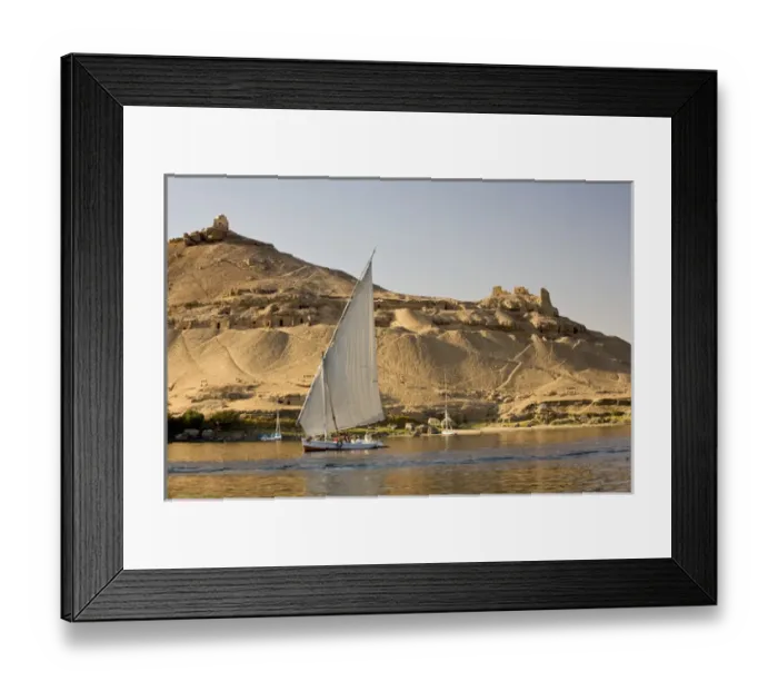Framed Print : EGYPT, Aswan. The rock-hewn Tombs of the Nobles pock mark the West bank of the Nile
