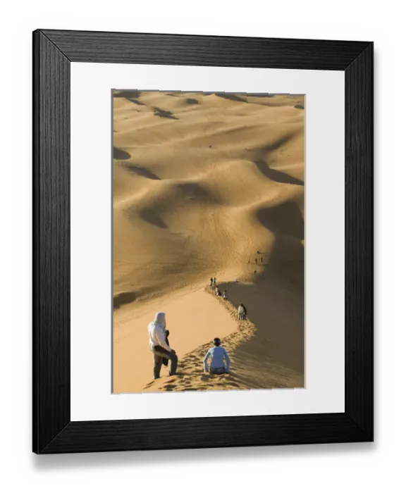 Framed Print : MOROCCO-Tafilalt-MERZOUGA: Erg Chebbi Dunes (up to 400 ft in height) and visitors (NR) Framed Print : MOROCCO-Tafilalt-MERZOUGA: Erg Chebbi Dunes (up to 400 ft in height) and visitors (NR)