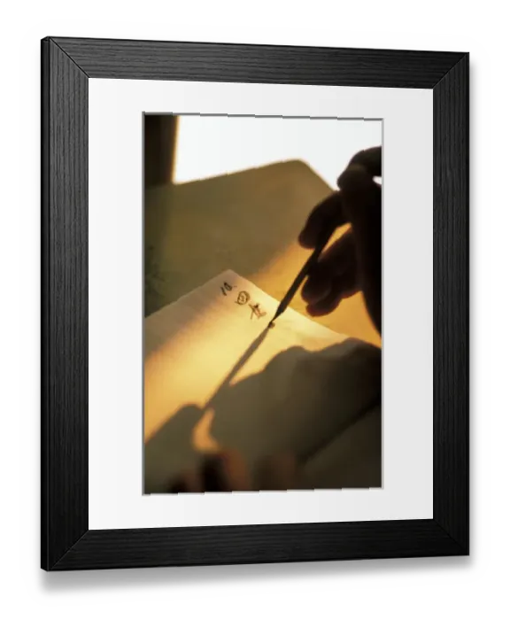 Framed Print : Thailand, Bangkok. Shop owner writes tahi script into notebook at sunset Framed Print : Thailand, Bangkok. Shop owner writes tahi script into notebook at sunset
