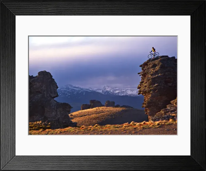 Framed Print : Mountain Biker on Rock Tor, Duffers Saddle, Carrick Range, Central Otago