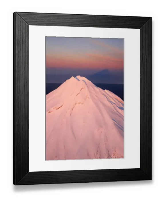 Framed Print : Alpenglow on Summit of Mt Taranaki / Mt Egmont at Dawn, and Shadow, Taranaki, North Island Framed Print : Alpenglow on Summit of Mt Taranaki / Mt Egmont at Dawn, and Shadow, Taranaki, North Island