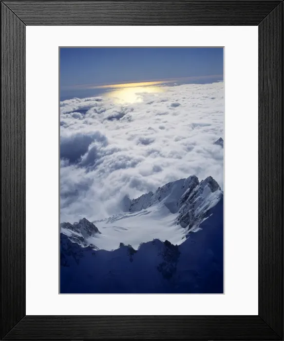 Framed Print : Sunlight reflects off the Tasman Sea beneath the jagged peaks of the Southern Alps Framed Print : Sunlight reflects off the Tasman Sea beneath the jagged peaks of the Southern Alps