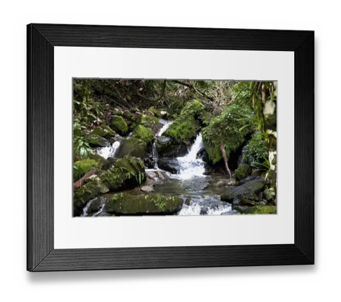 Framed Print : Puerto Rico - River water is cascading over rocks as it passes though a tropical setting