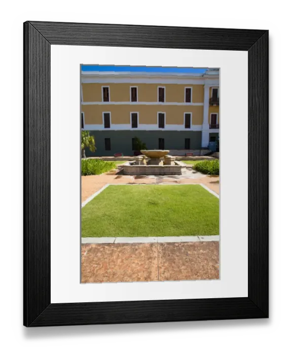 Framed Print : San Juan, Puerto Rico - A hotel fountain in a courtyard is sitting with no water in it Framed Print : San Juan, Puerto Rico - A hotel fountain in a courtyard is sitting with no water in it