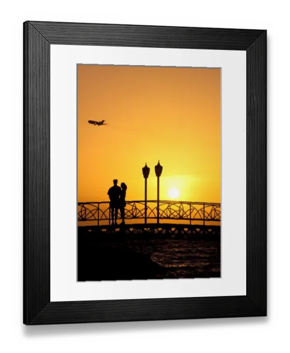 Framed Print : Caribbean, Aruba, Oranjestad. Couple enjoying sunset with plane overhead Framed Print : Caribbean, Aruba, Oranjestad. Couple enjoying sunset with plane overhead