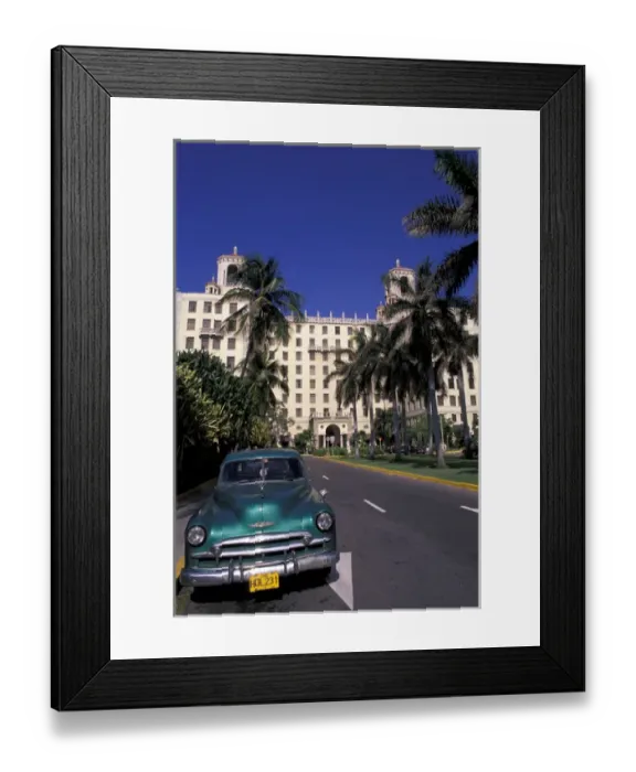 Framed Print : Cuba, Havana. Classic 1950s auto in front of Habana Nacional Hotel