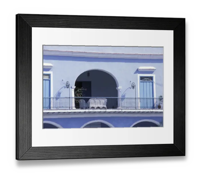 Framed Print : Cuba, Havana. Balcony of blue building with white wicker furniture in archway. Credit as Framed Print : Cuba, Havana. Balcony of blue building with white wicker furniture in archway. Credit as