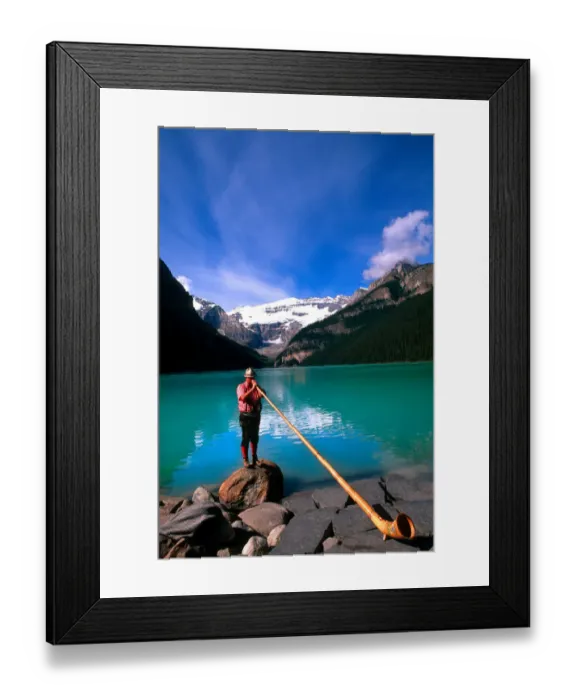 Framed Print : Swiss Alphorn player at Lake Louise in Banff Canada Framed Print : Swiss Alphorn player at Lake Louise in Banff Canada