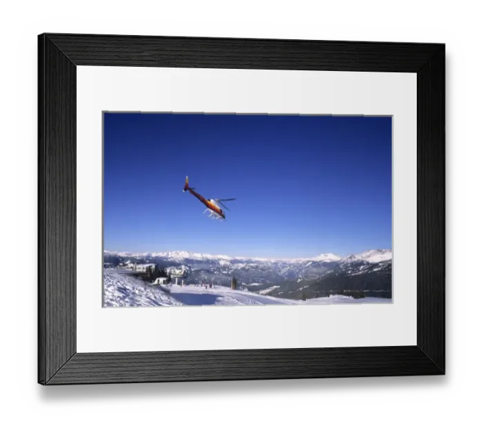 Framed Print : Helicopter skiing at famous ski town of Whistler in British Columbia Canada Framed Print : Helicopter skiing at famous ski town of Whistler in British Columbia Canada