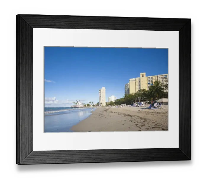 Framed Print : San Juan, Puerto Rico - People are relaxing in beach chairs on the beach of a resort hotel Framed Print : San Juan, Puerto Rico - People are relaxing in beach chairs on the beach of a resort hotel