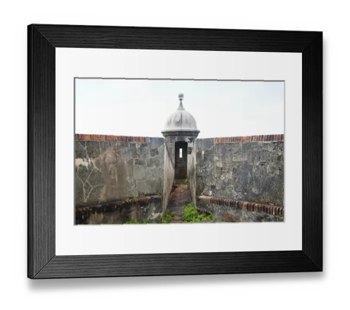 Framed Print : San Juan, Puerto Rico - Stone walls lead to a narrow passage way going to a watchtower