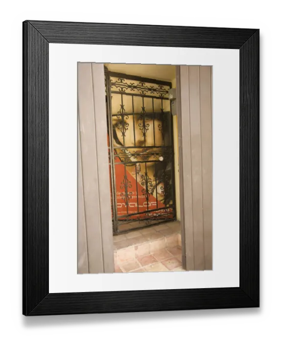 Framed Print : Caribbean, Puerto Rico, Old San Juan. Painting of woman behind wrought-iron grill Framed Print : Caribbean, Puerto Rico, Old San Juan. Painting of woman behind wrought-iron grill