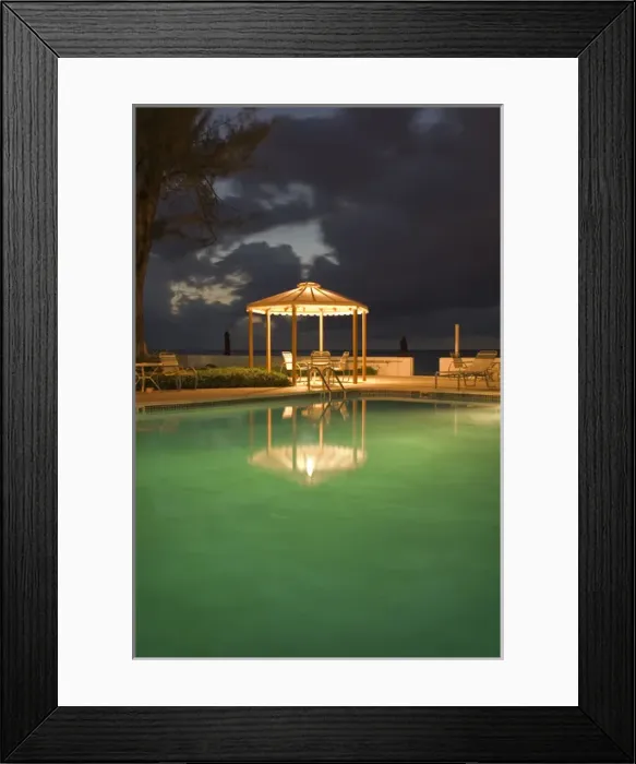 Framed Print : Caribbean Sea, Cayman Islands. A resort pool at night Framed Print : Caribbean Sea, Cayman Islands. A resort pool at night