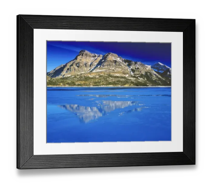 Framed Print : Vimy Peak reflects into Waterton Lake in winter in Waterton Lakes National Park in Framed Print : Vimy Peak reflects into Waterton Lake in winter in Waterton Lakes National Park in