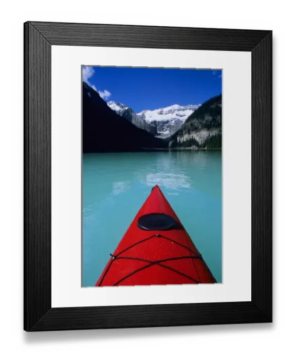 Framed Print : Kayak on Lake Louise below Mount Victoria in the Canadian Rockies; Banff National Park; Alberta