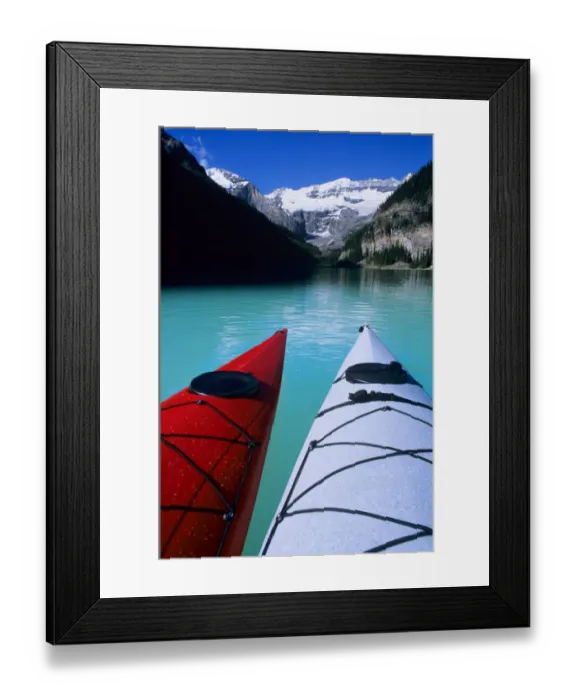 Framed Print : Kayaks on Lake Louise below Mount Victoria in the Canadian Rockies; Banff National Park; Alberta