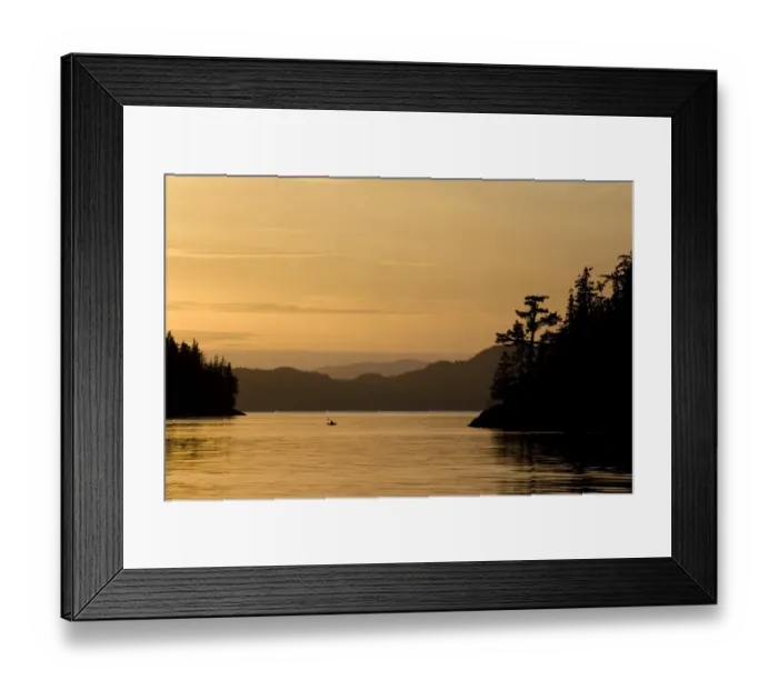 Framed Print : Canada, British Columbia, Princess Royal Island. Kayaker navigates Bernard Harbor at sunset