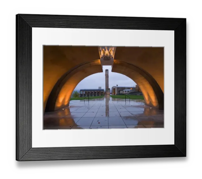 Framed Print : Lights throw golden light on the concrete arched entrance to Mission Hill Family Framed Print : Lights throw golden light on the concrete arched entrance to Mission Hill Family