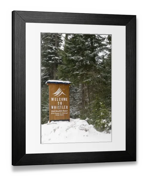 Framed Print : CA, BC, Whistler. Fresh snow piled atop entrance sign to Whistler announcing 2010
