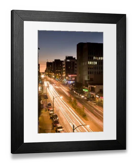 Framed Print : Traffic streaks by on a busy street in Vancouver, BC, Canada Framed Print : Traffic streaks by on a busy street in Vancouver, BC, Canada