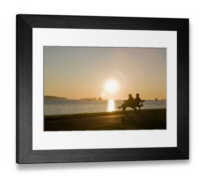 Framed Print : Watching the sunset at English Bay Beach in the West End of Vancouver, BC, Canada