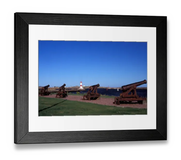 Framed Print : North America, Canada, Miquelon and St. Pierre, St. Pierre harbor lighthouse and cannons Framed Print : North America, Canada, Miquelon and St. Pierre, St. Pierre harbor lighthouse and cannons