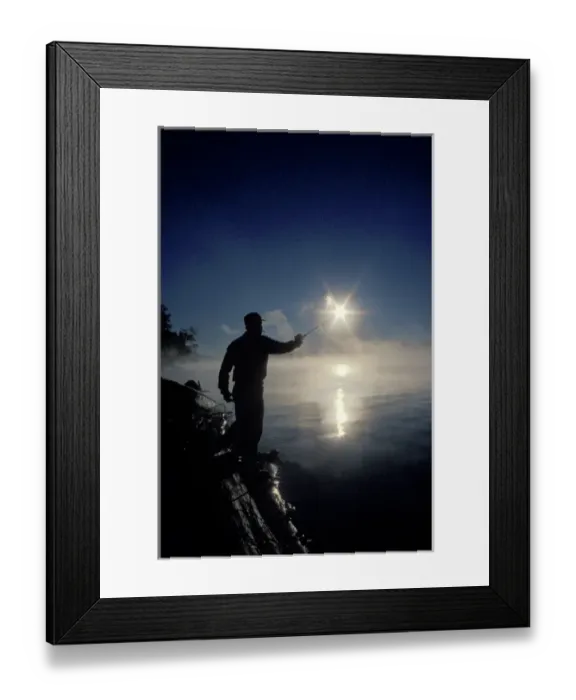 Framed Print : Canada, Ontario, Silhouette of fisherman casting a line into lake on a summer sunrise Framed Print : Canada, Ontario, Silhouette of fisherman casting a line into lake on a summer sunrise
