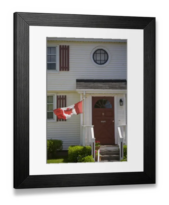 Framed Print : Canada, Prince Edward Island, Charlottetown. Historic home flying Canadian flag Framed Print : Canada, Prince Edward Island, Charlottetown. Historic home flying Canadian flag