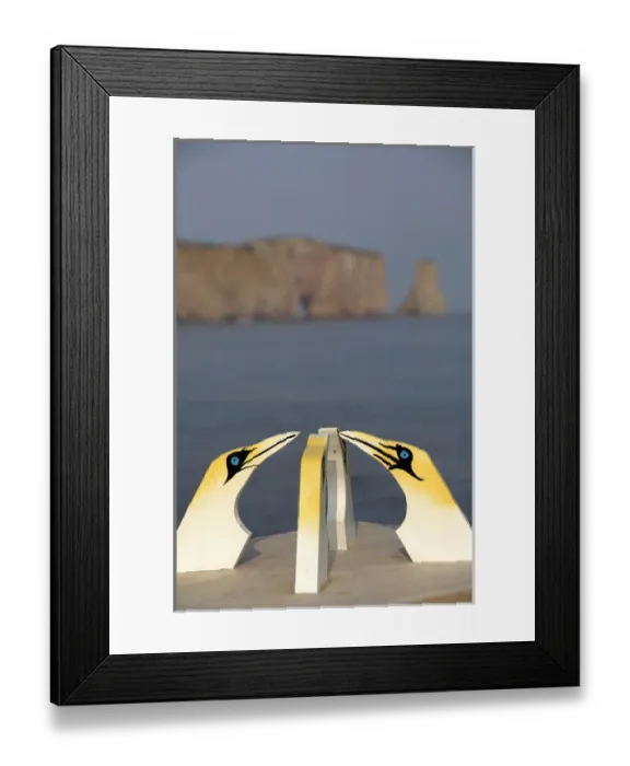 Framed Print : Canada, Quebec, Perce. Wooden gannets with view of St. Lawrence River & Perce Rock in distance Framed Print : Canada, Quebec, Perce. Wooden gannets with view of St. Lawrence River & Perce Rock in distance