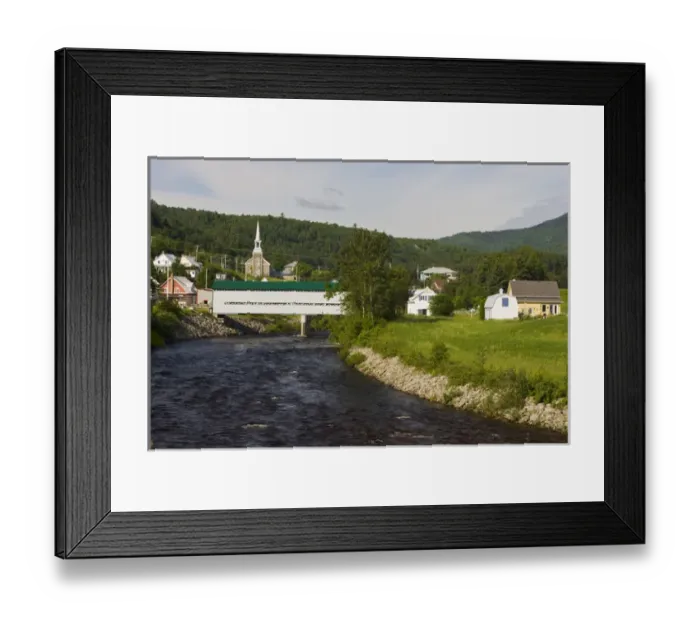 Framed Print : Fauberg covered bridge and the village of l Anse St. Jean in the Saguenay River