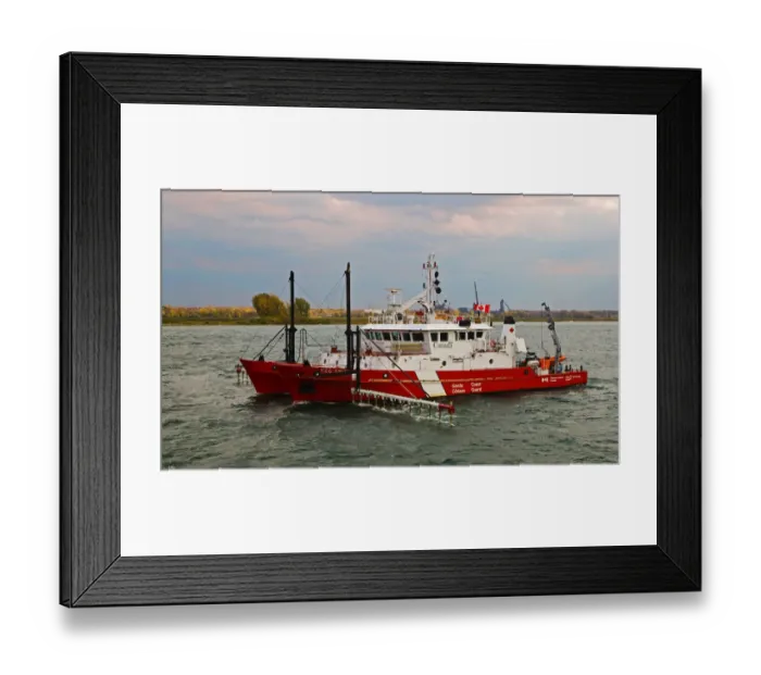 Framed Print : Sailing down The St. Lawrence River towards Montreal, watching a Canadian Coast Gard Framed Print : Sailing down The St. Lawrence River towards Montreal, watching a Canadian Coast Gard
