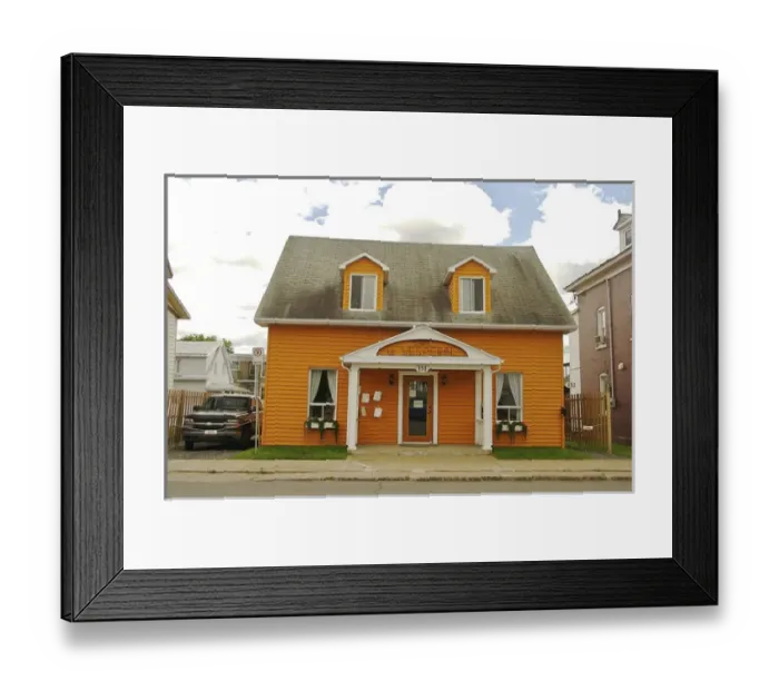 Framed Print : North America, Canada, Quebec, Mauricie, Grand-Mere. A bright orange cafe