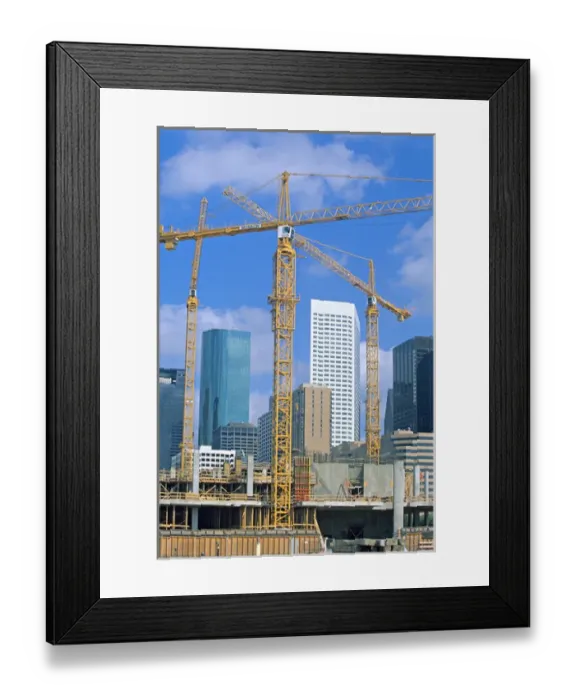 Framed Print : Tower cranes commercial construction site Framed Print : Tower cranes commercial construction site