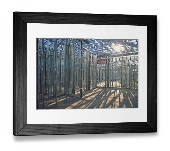 Framed Print : New home steel framing at construction site Framed Print : New home steel framing at construction site