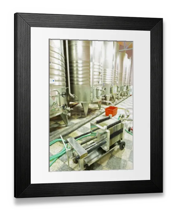 Framed Print : Stainless steel fermentation tanks with cooling coils on the outside. Plate cellulose Framed Print : Stainless steel fermentation tanks with cooling coils on the outside. Plate cellulose