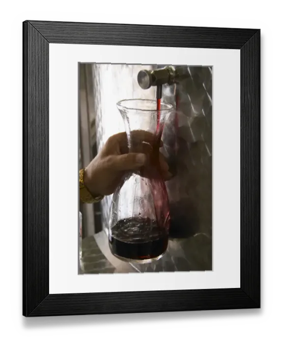 Framed Print : Taking a tank sample of red wine from a stainless steel tank into a glass decanter