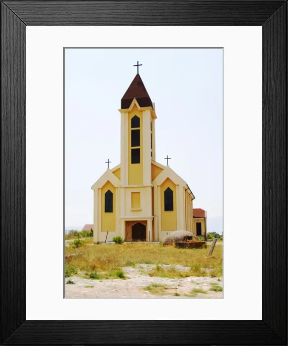 Framed Print : An abandoned church in the countryside. In font of the church a typical Albanian