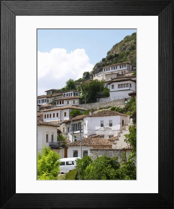 Framed Print : The modern lower part of the village crawling up the hillside with white washed ottoman