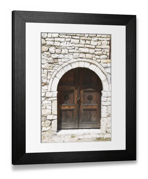 Framed Print : Stone wall with old wooden door with chain and pad lock. Berat upper citadel old walled city Framed Print : Stone wall with old wooden door with chain and pad lock. Berat upper citadel old walled city