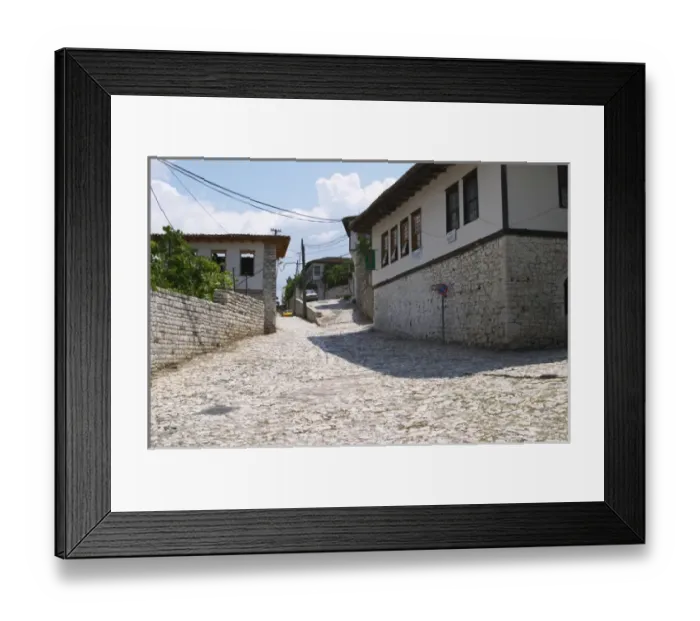Framed Print : Street scene up towards the centre of the village from the entrance gate with old houses Framed Print : Street scene up towards the centre of the village from the entrance gate with old houses