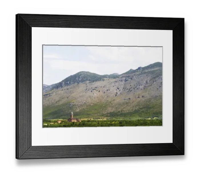 Framed Print : A church on the plain dominated by the Kastrat Shkrel mountains near Koplik Framed Print : A church on the plain dominated by the Kastrat Shkrel mountains near Koplik