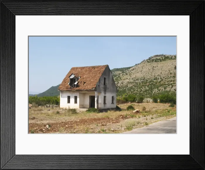 Framed Print : An abandoned house falling to pieces on the dry plain along the road between Shkodra Framed Print : An abandoned house falling to pieces on the dry plain along the road between Shkodra