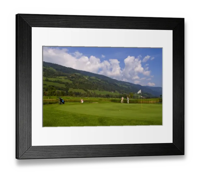 Framed Print : Beautiful golf with golfers at the #18 hole at exclusive Golf Club Murau Kreischberg Framed Print : Beautiful golf with golfers at the #18 hole at exclusive Golf Club Murau Kreischberg