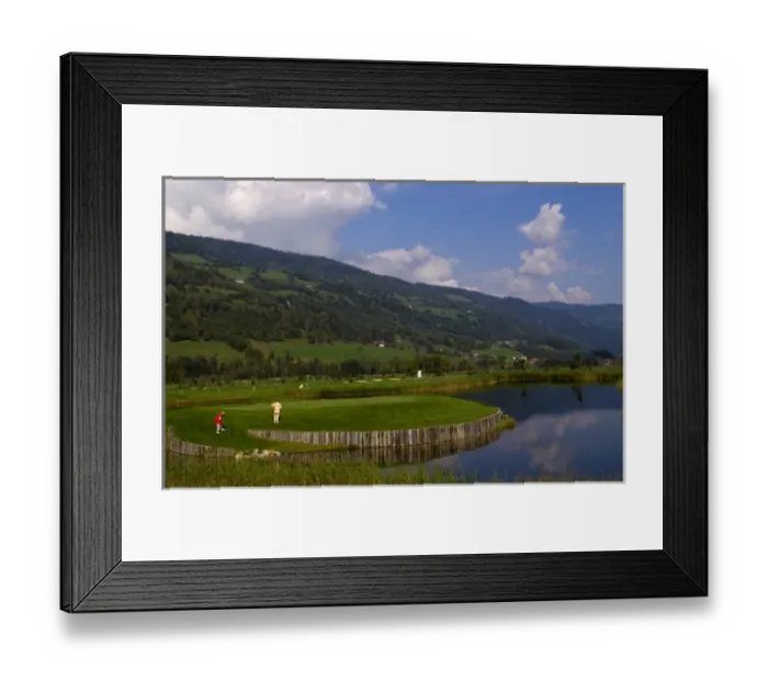 Framed Print : Beautiful golf with golfers at the #18 hole at exclusive Golf Club Murau Kreischberg