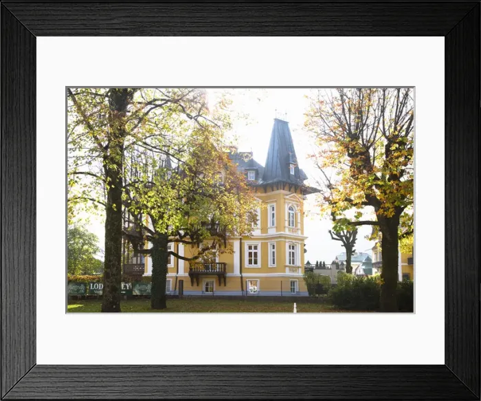 Framed Print : Bad Ischl, Upper Austria, Austria - Low angle view of a yellow, old world style home Framed Print : Bad Ischl, Upper Austria, Austria - Low angle view of a yellow, old world style home