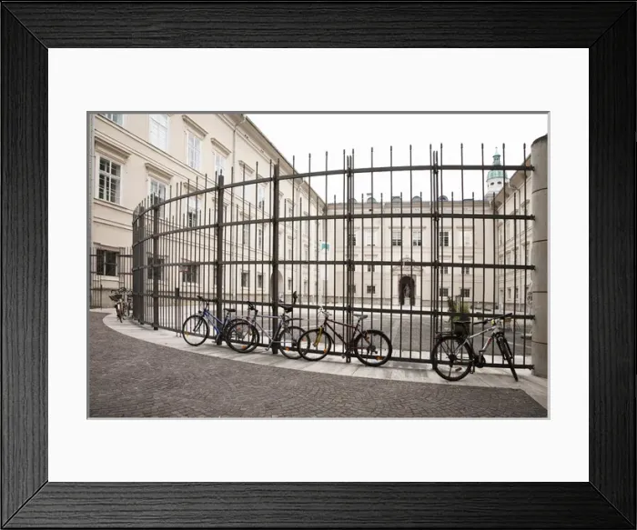 Framed Print : Salzburg, Salzburg, Austria - Bicycles parked against a tall, wrough-iron fence Framed Print : Salzburg, Salzburg, Austria - Bicycles parked against a tall, wrough-iron fence